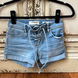 Adorable lace up Jean shorts. Super stretch shortie.